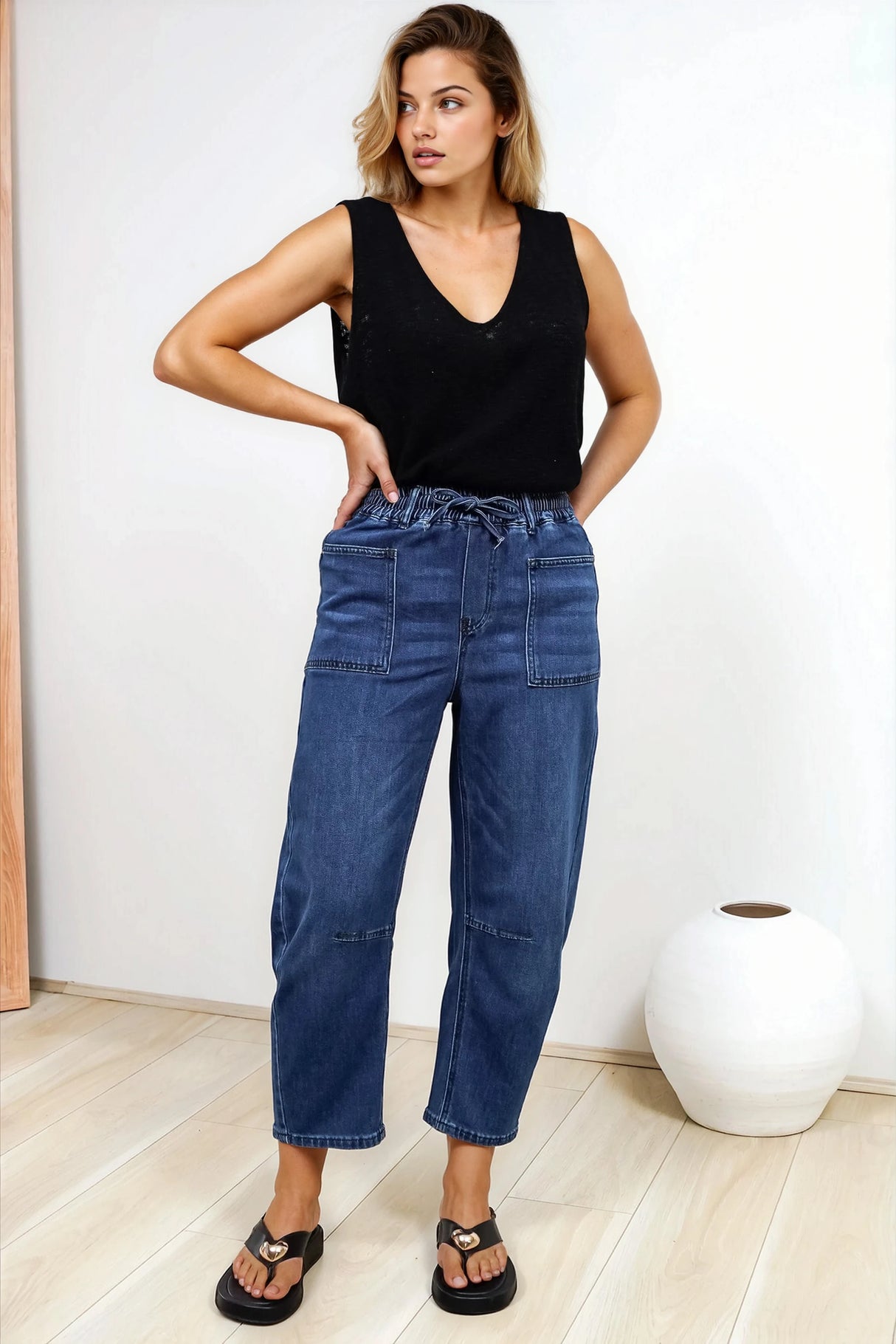 Model wearing Lowen Barrel Jeans in Dark Denim from Salty Crush