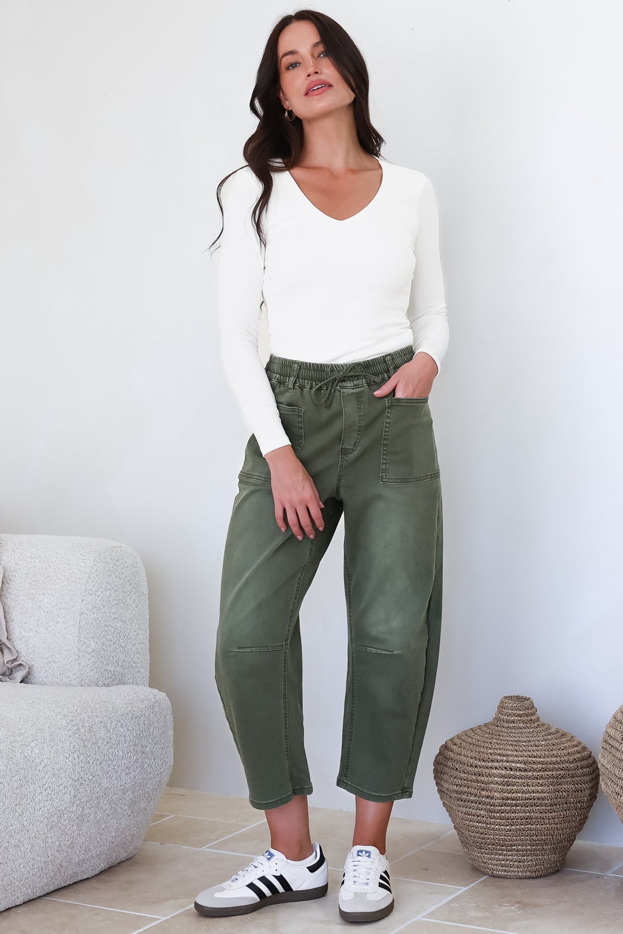 Model wearing Lowen Barrel Jeans in Khaki from Salty Crush
