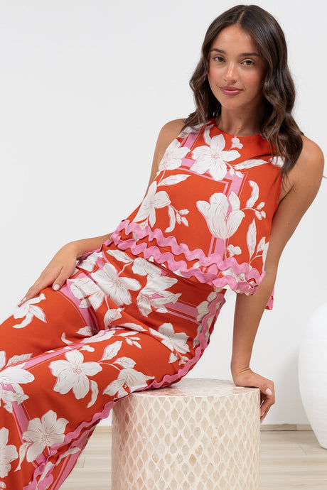 Luchia Jumpsuit - Sleeveless Overlay Bodice Jumpsuit with Ric Rac Trims in Blossaria Print