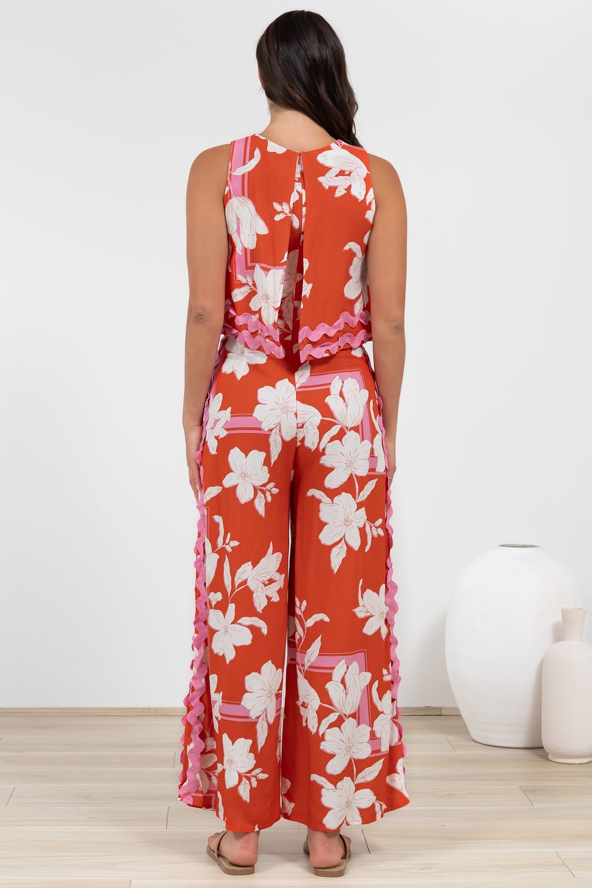 Luchia Jumpsuit - Sleeveless Overlay Bodice Jumpsuit with Ric Rac Trims in Blossaria Print