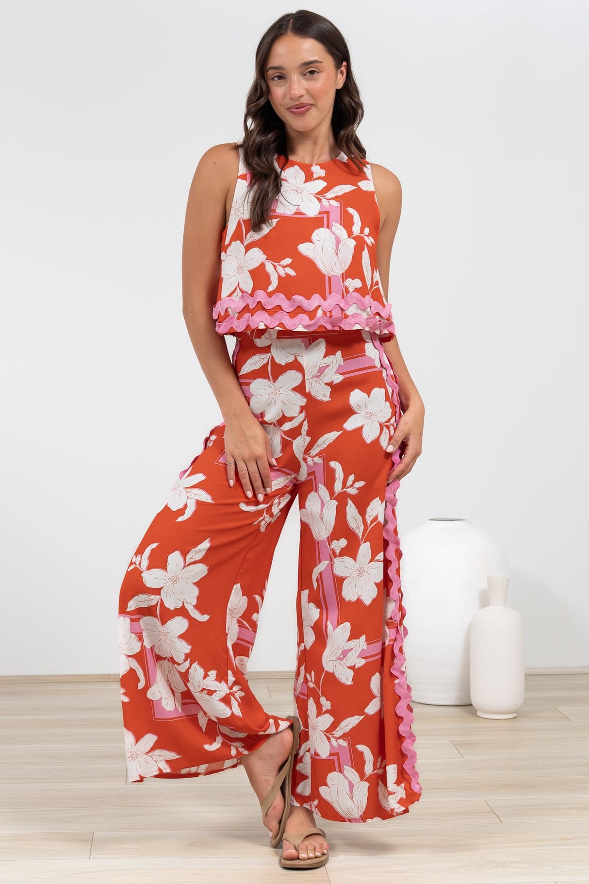 Luchia Jumpsuit - Sleeveless Overlay Bodice Jumpsuit with Ric Rac Trims in Blossaria Print