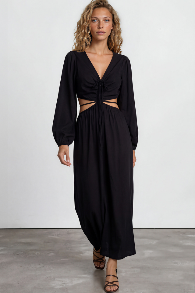 Woman wearing a black dress with cut-out design on a white background