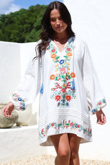 Model wearing Margerie Long Sleeve Mini Dress in White from Salty Crush