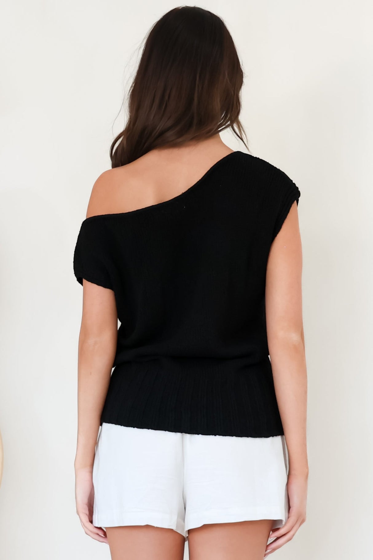 Mariah Knit Top - Sleeveless Asymmetric Neckline Top with Ribbed Hem in Black