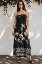 Model wearing Mattina Maxi Dress in Aviv Print Black from Salty Crush