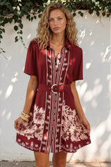 Model wearing Mikan Mini Dress in Orabella Print Wine from Salty Crush