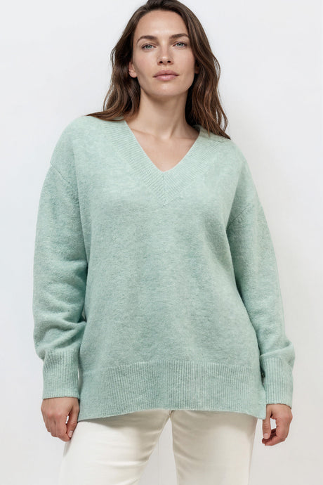 Model wearing Nikita Jumper in Green from Salty Crush