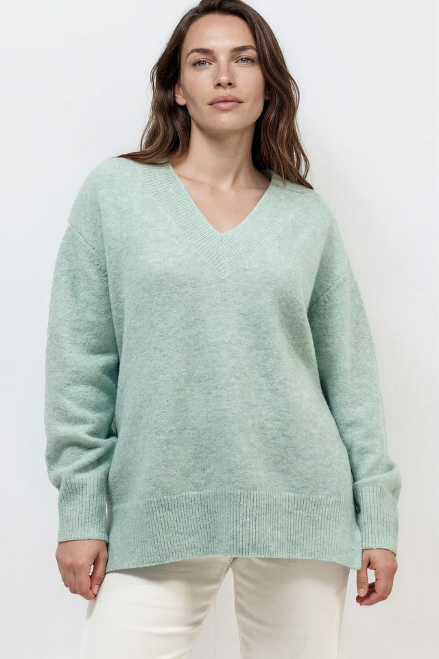 Model wearing Nikita Jumper in Green from Salty Crush
