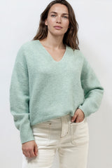 Model wearing Nikita Jumper in Green from Salty Crush
