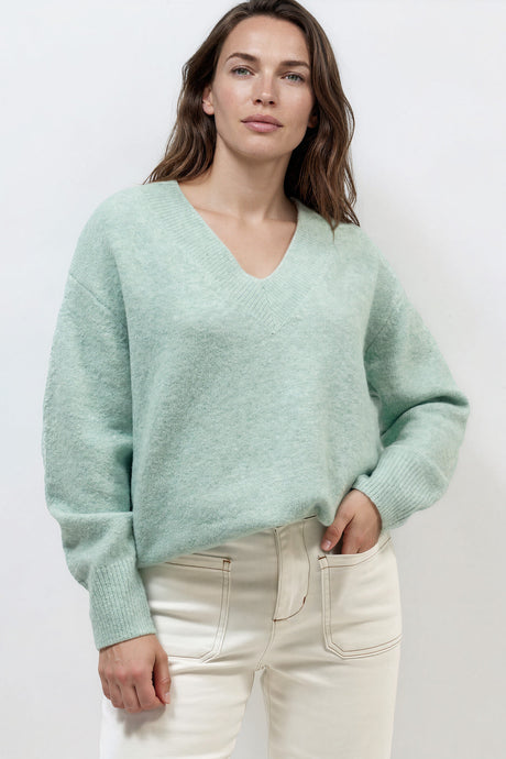 Model wearing Nikita Jumper in Green from Salty Crush
