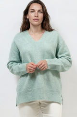 Model wearing Nikita Jumper in Green from Salty Crush