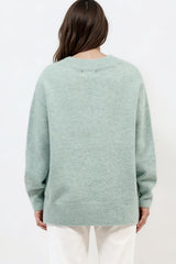 Model wearing Nikita Jumper in Green from Salty Crush