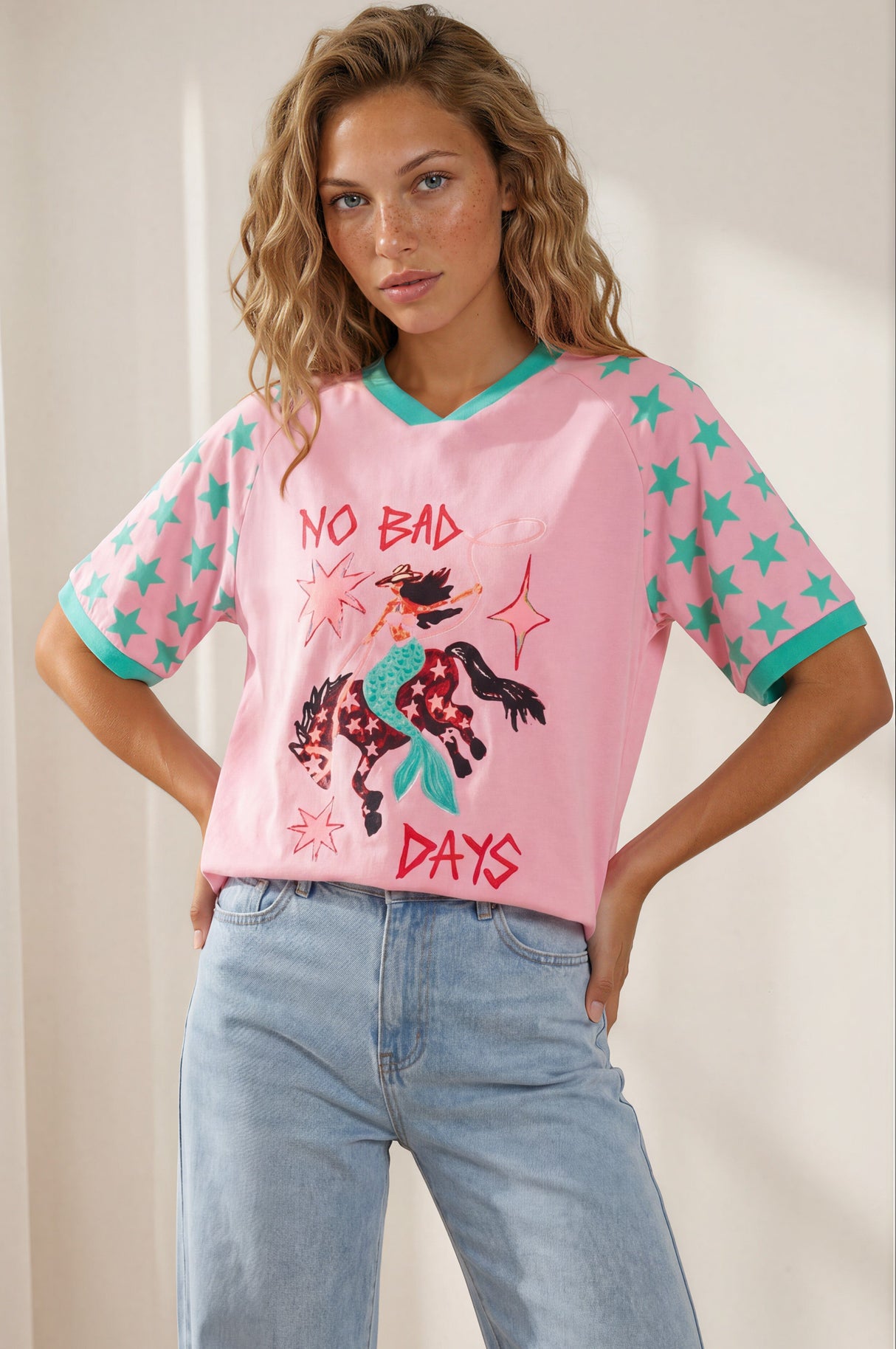 Model wearing No Bad Days Tee in Pink from Salty Crush