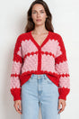 Model wearing Nolar Cardigan in Pink/Red from Salty Crush