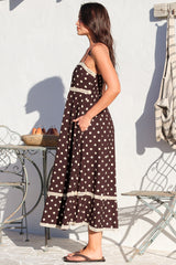 Model wearing Novalie Midi Dress in Polka Chocolate from Salty Crush