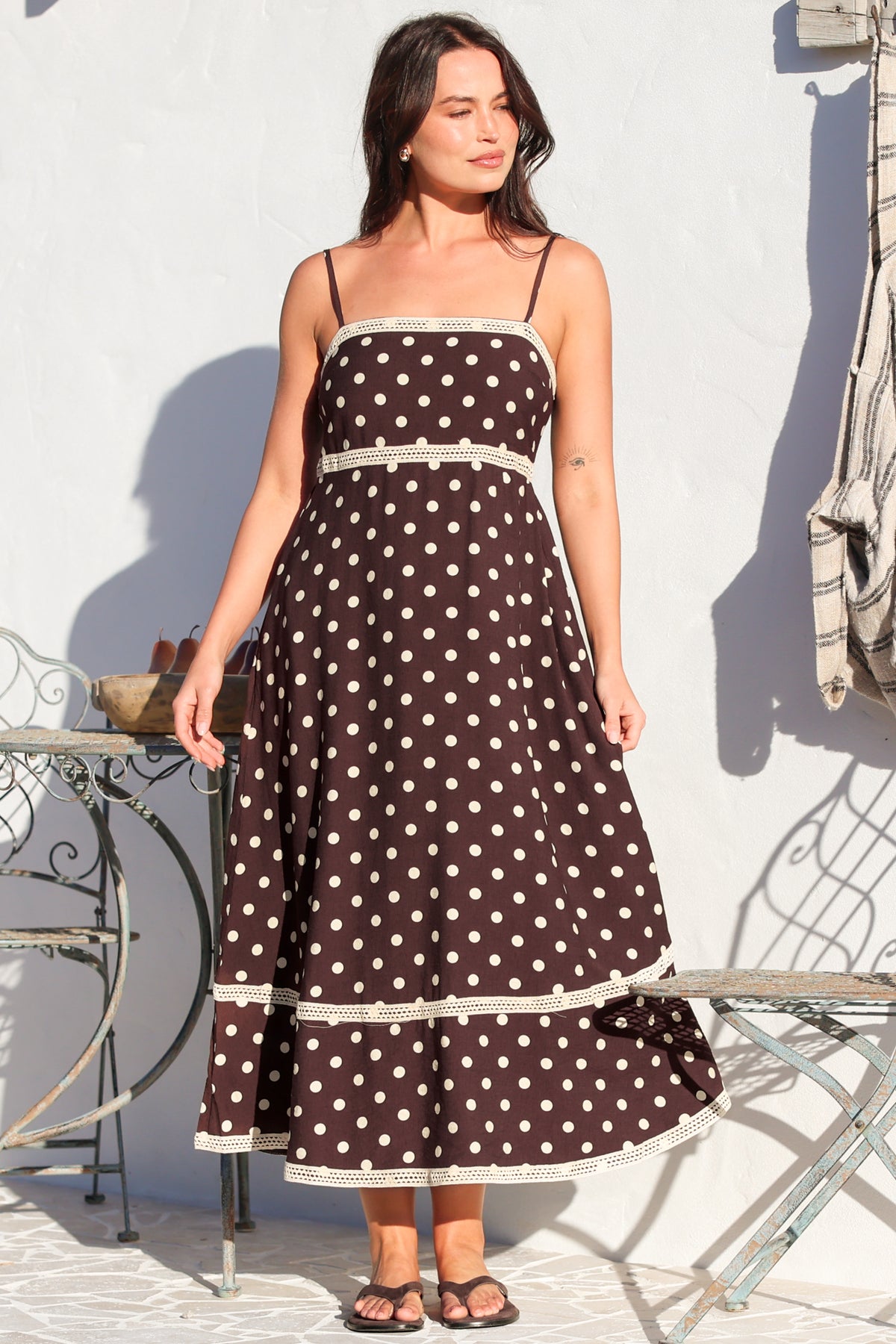 Model wearing Novalie Midi Dress in Polka Chocolate from Salty Crush