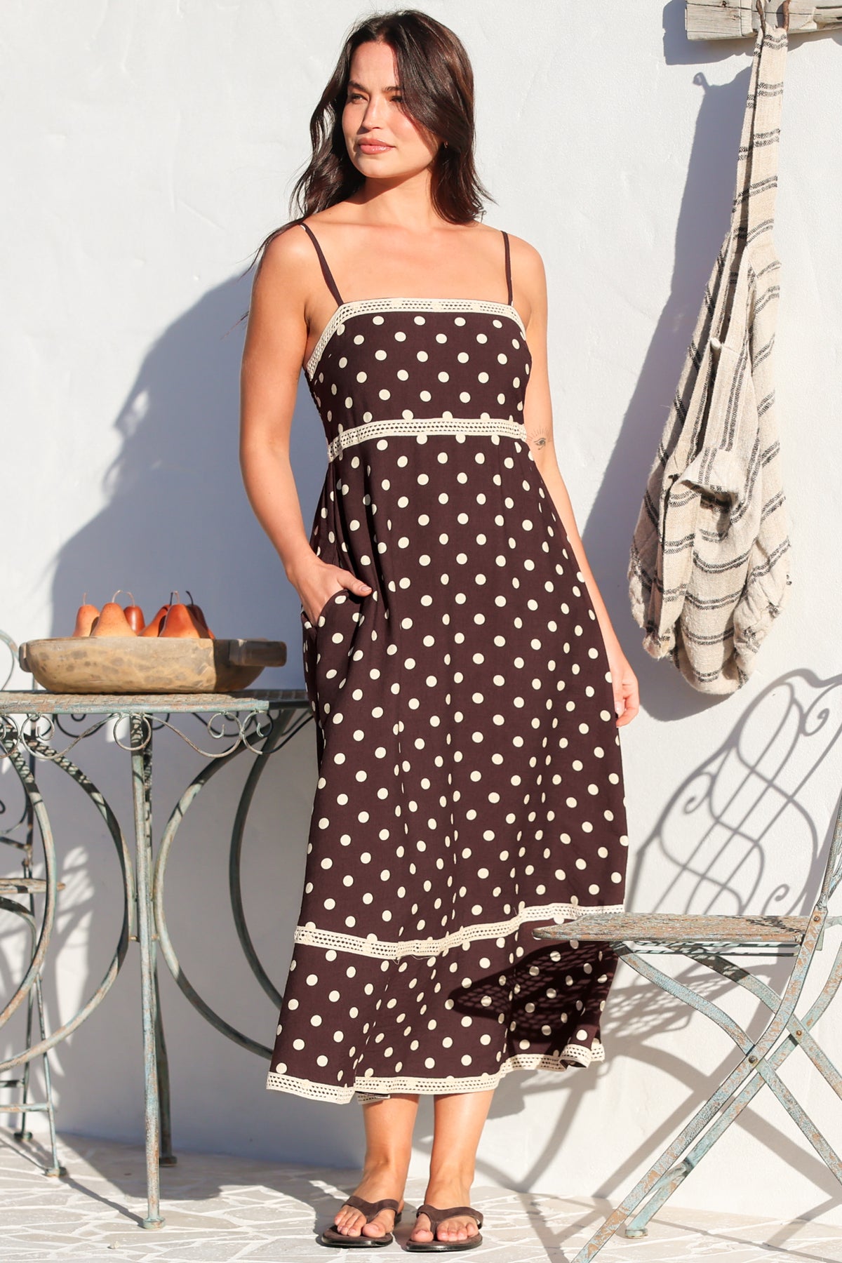 Model wearing Novalie Midi Dress in Polka Chocolate from Salty Crush