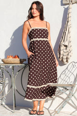 Model wearing Novalie Midi Dress in Polka Chocolate from Salty Crush