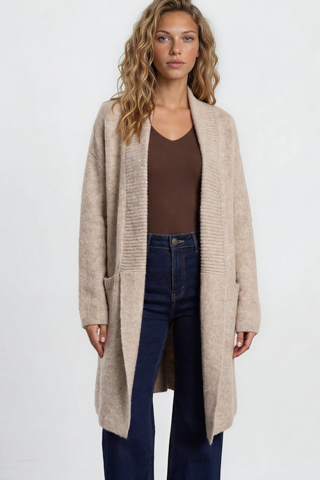 Model wearing Oswin Cardigan in Beige from Salty Crush