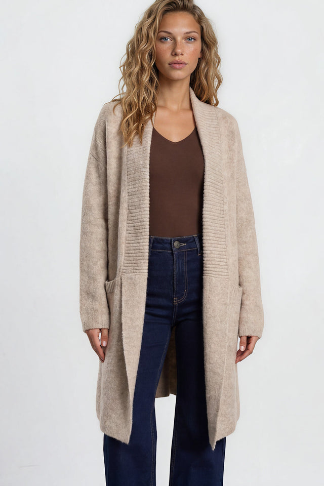 Model wearing Oswin Cardigan in Beige from Salty Crush
