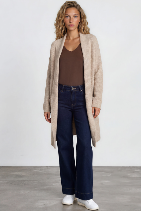 Model wearing Oswin Cardigan in Beige from Salty Crush