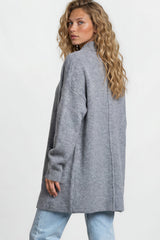 Model wearing Oswin Cardigan in Blue from Salty Crush