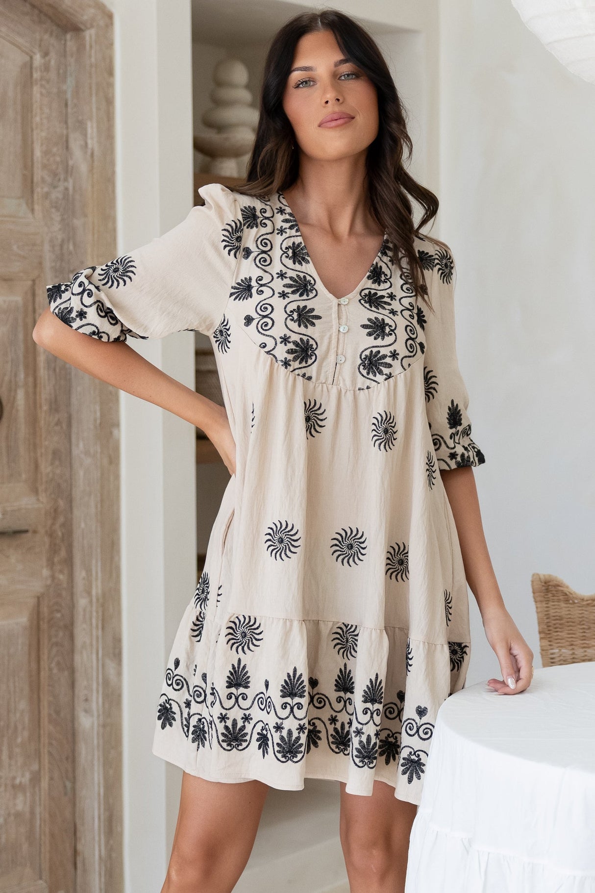 Patty Mini Dress - V-Neck Embroidered Babydoll Dress with 3/4 Sleeves in Solsana Print in Black