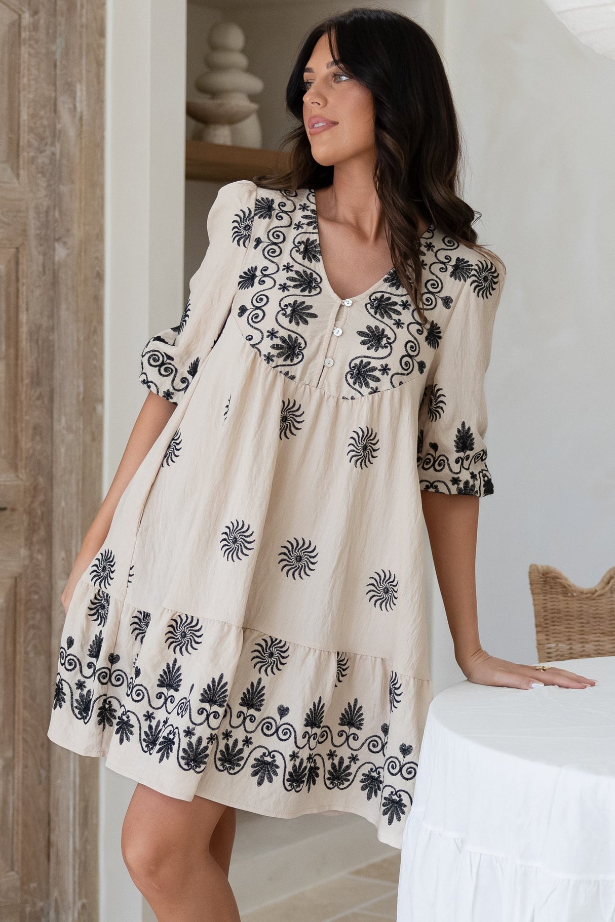 Patty Mini Dress - V-Neck Embroidered Babydoll Dress with 3/4 Sleeves in Solsana Print in Black