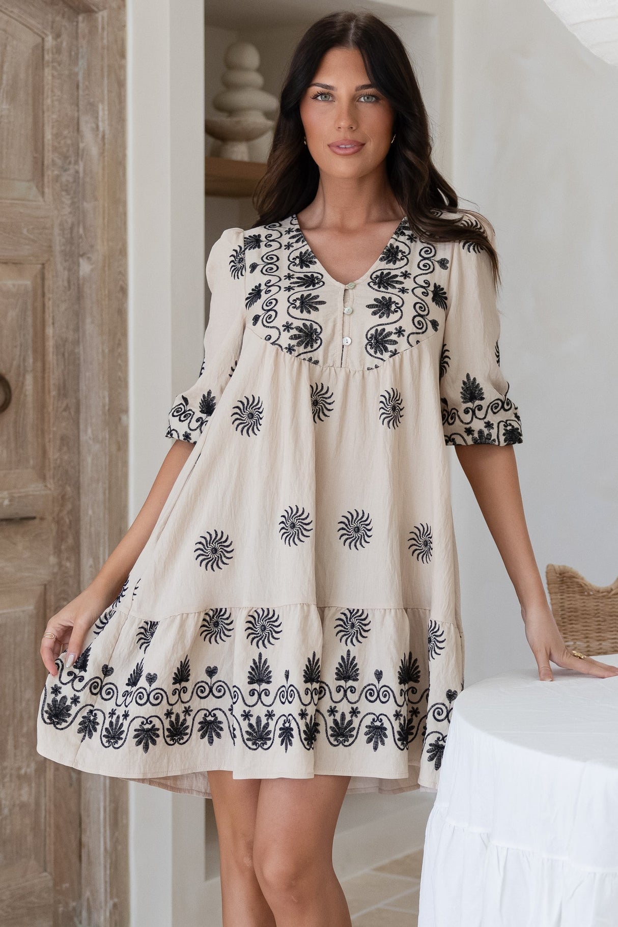 Patty Mini Dress - V-Neck Embroidered Babydoll Dress with 3/4 Sleeves in Solsana Print in Black