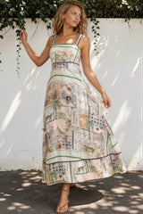 Woman wearing a patterned dress standing on a staircase.