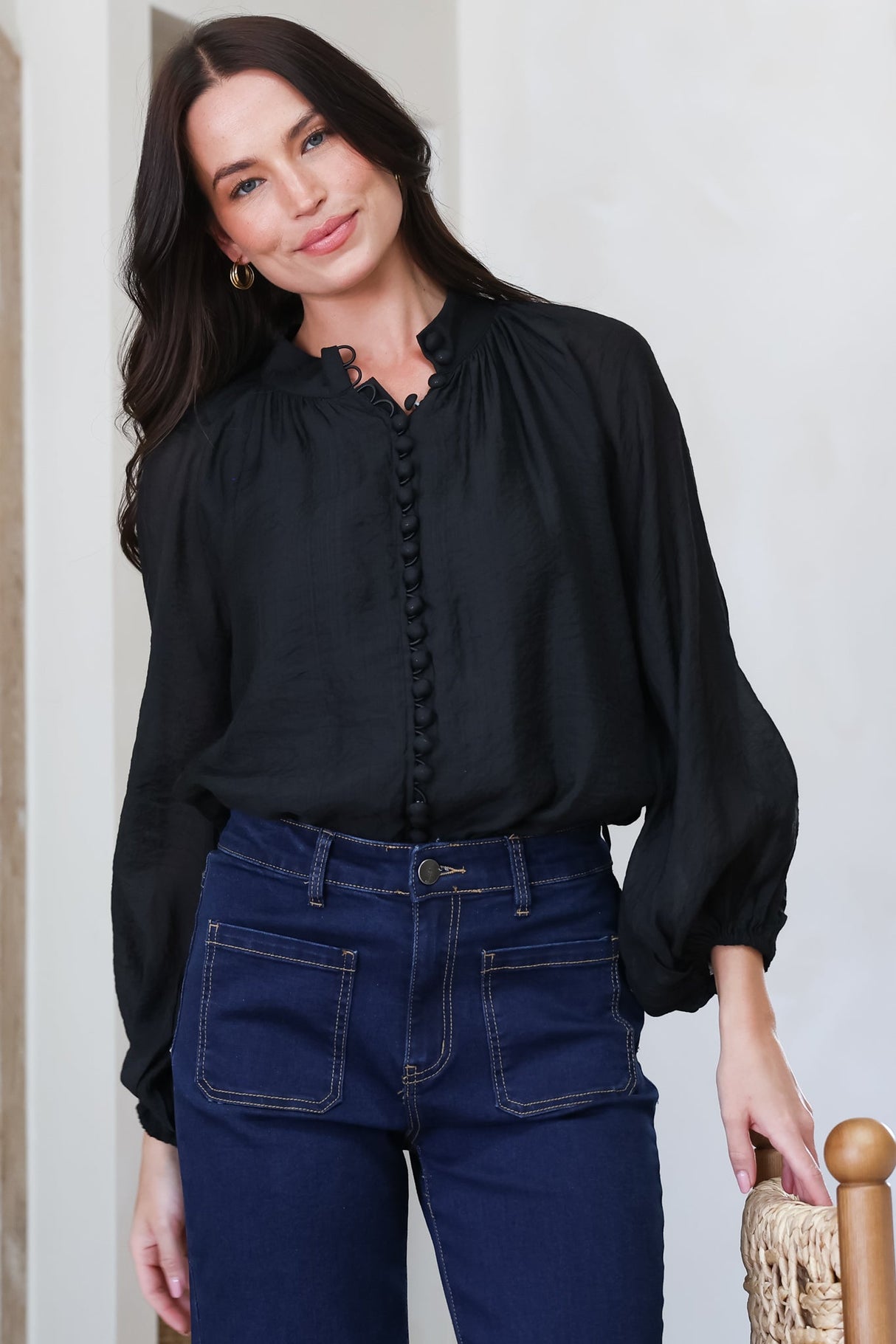 Model wearing Portia Blouse in Black from Salty Crush