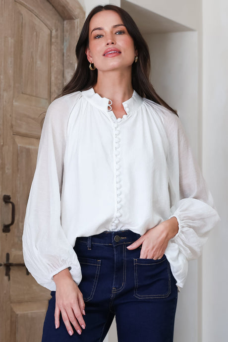 Model wearing Portia Blouse in Cream from Salty Crush