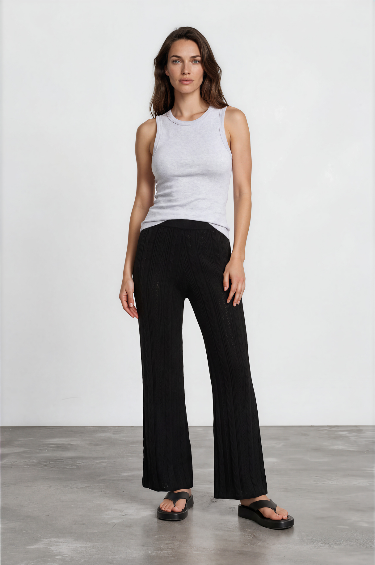 Model wearing Ravio Knit Pants in Black from Salty Crush