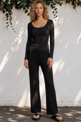 Model wearing Ravio Knit Pants in Black from Salty Crush