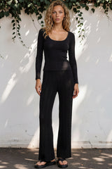 Model wearing Ravio Knit Pants in Black from Salty Crush