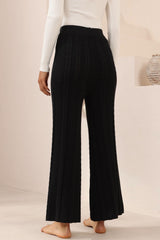Model wearing Ravio Knit Pants in Black from Salty Crush