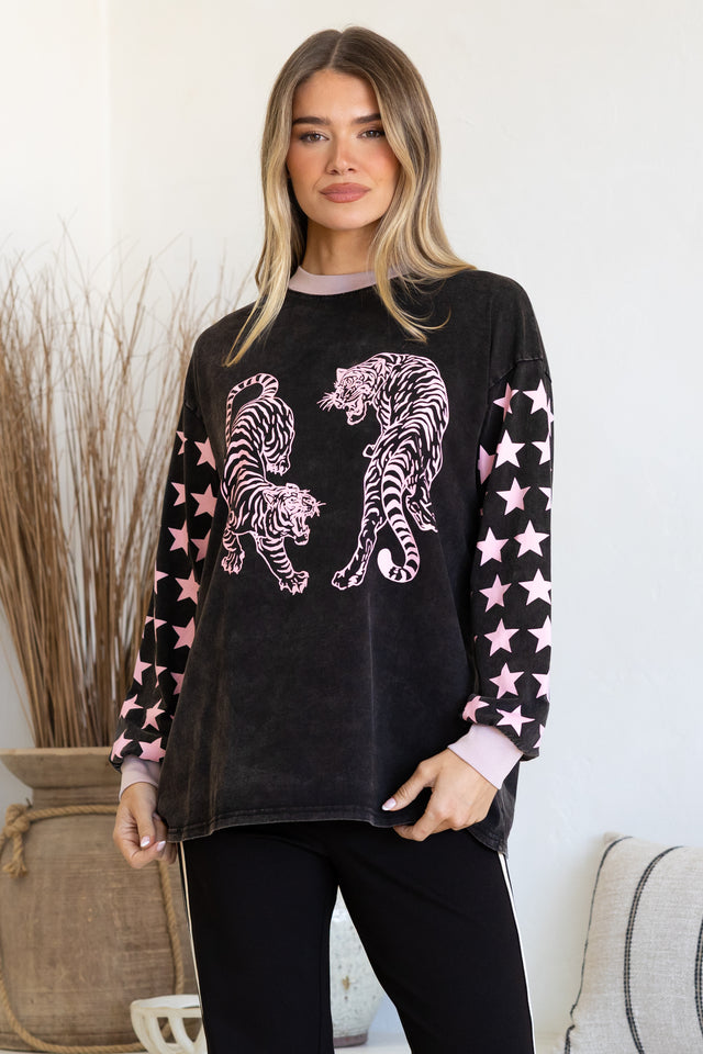 Model wearing Rival Tiger Long Sleeve Tee in Black Acid Wash from Salty Crush