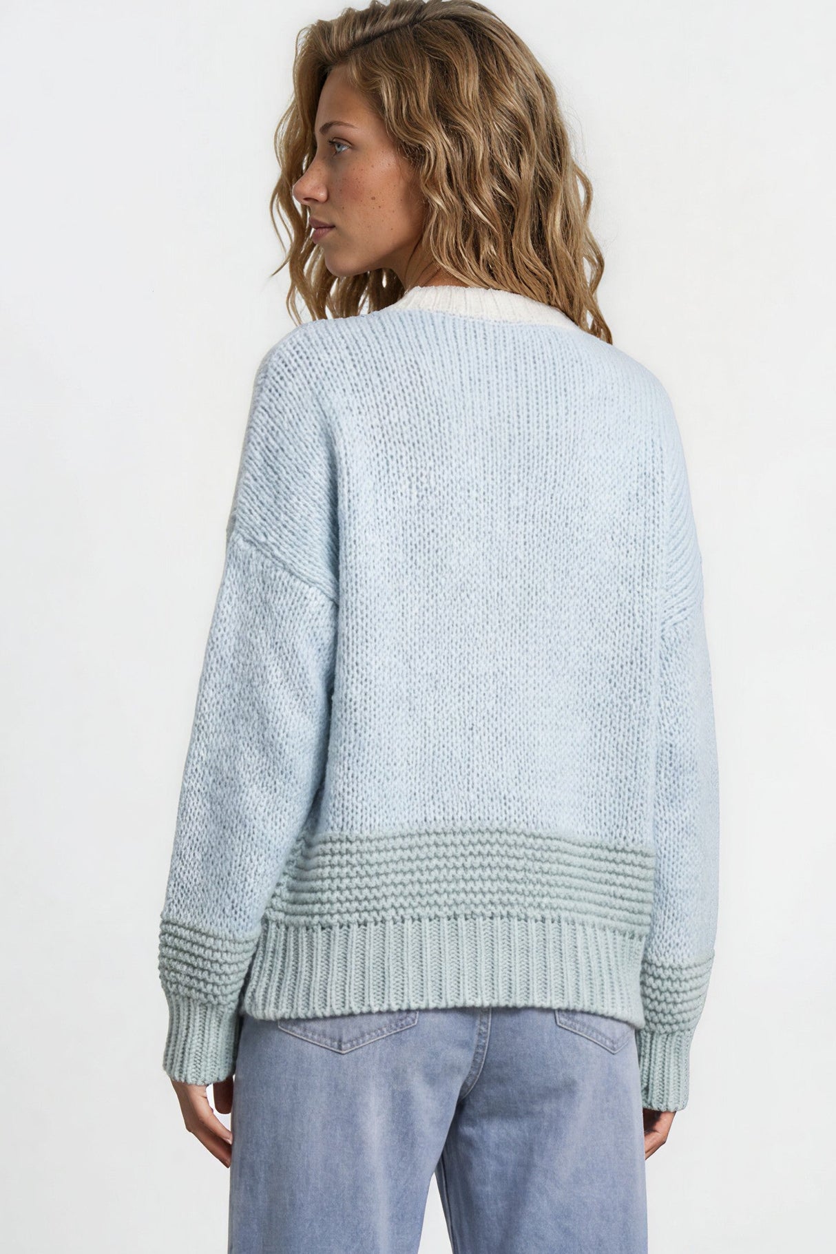 Model wearing Rosie Cardigan in  Blue/Green from Salty Crush