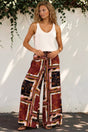 Model wearing Rune Pants in Celia Print from Salty Crush