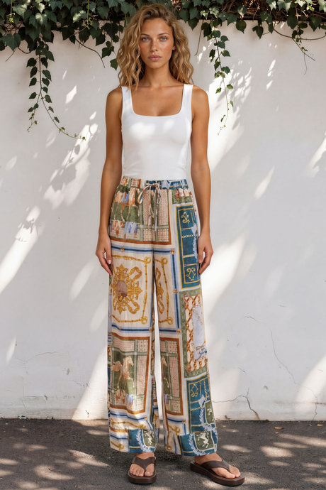 Model wearing Rune Pants in Regalia Print from Salty Crush