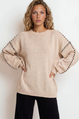 Model wearing Saige Jumper in Beige from Salty Crush
