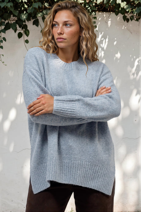 Model wearing Sandro Jumper in Blue from Salty Crush