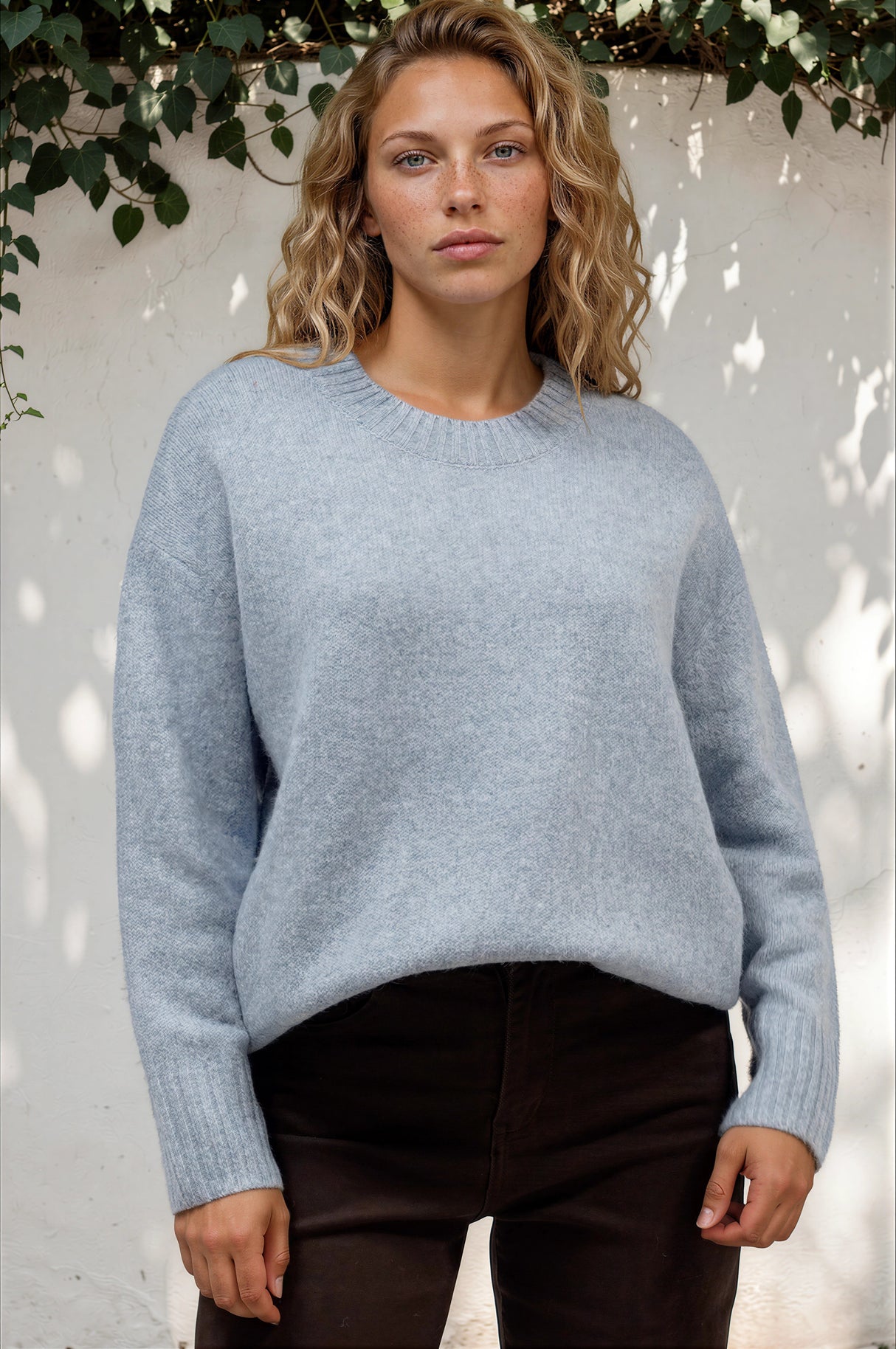 Model wearing Sandro Jumper in Blue from Salty Crush