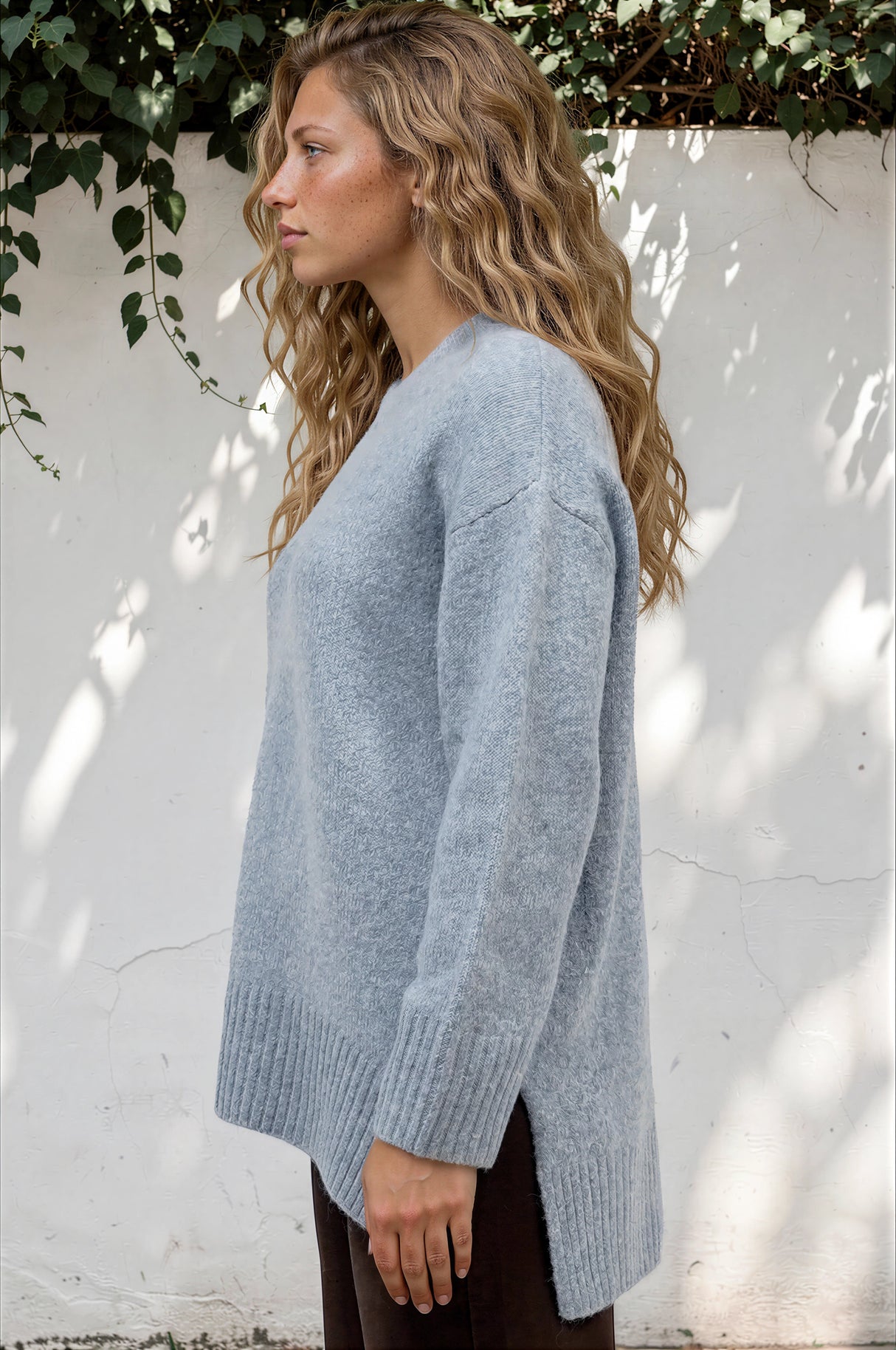 Model wearing Sandro Jumper in Blue from Salty Crush