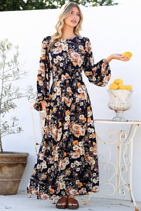 Model wearing Sheyne Maxi Dress in Autumn Print from Salty Crush