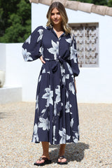 Model wearing Skandi Midi Dress in Midnight Lily Print from Salty Crush