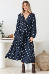 Model wearing Soho Midi Dress in Parisian Polka Print Navy from Salty Crush