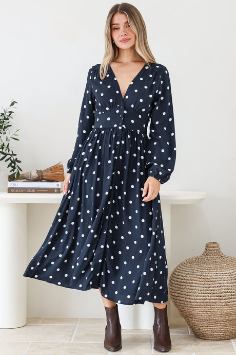 Model wearing Soho Midi Dress in Parisian Polka Print Navy from Salty Crush