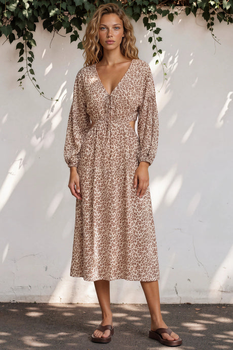 Model wearing Sona Midi Dress in Leo Lily Print from Salty Crush
