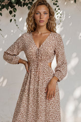 Model wearing Sona Midi Dress in Leo Lily Print from Salty Crush
